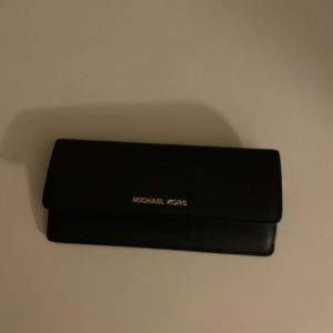 Black Michael Kors wallet.